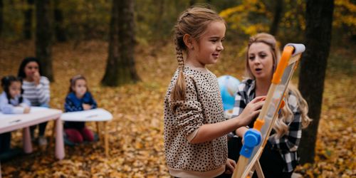 Child learning in an outdoor classroom